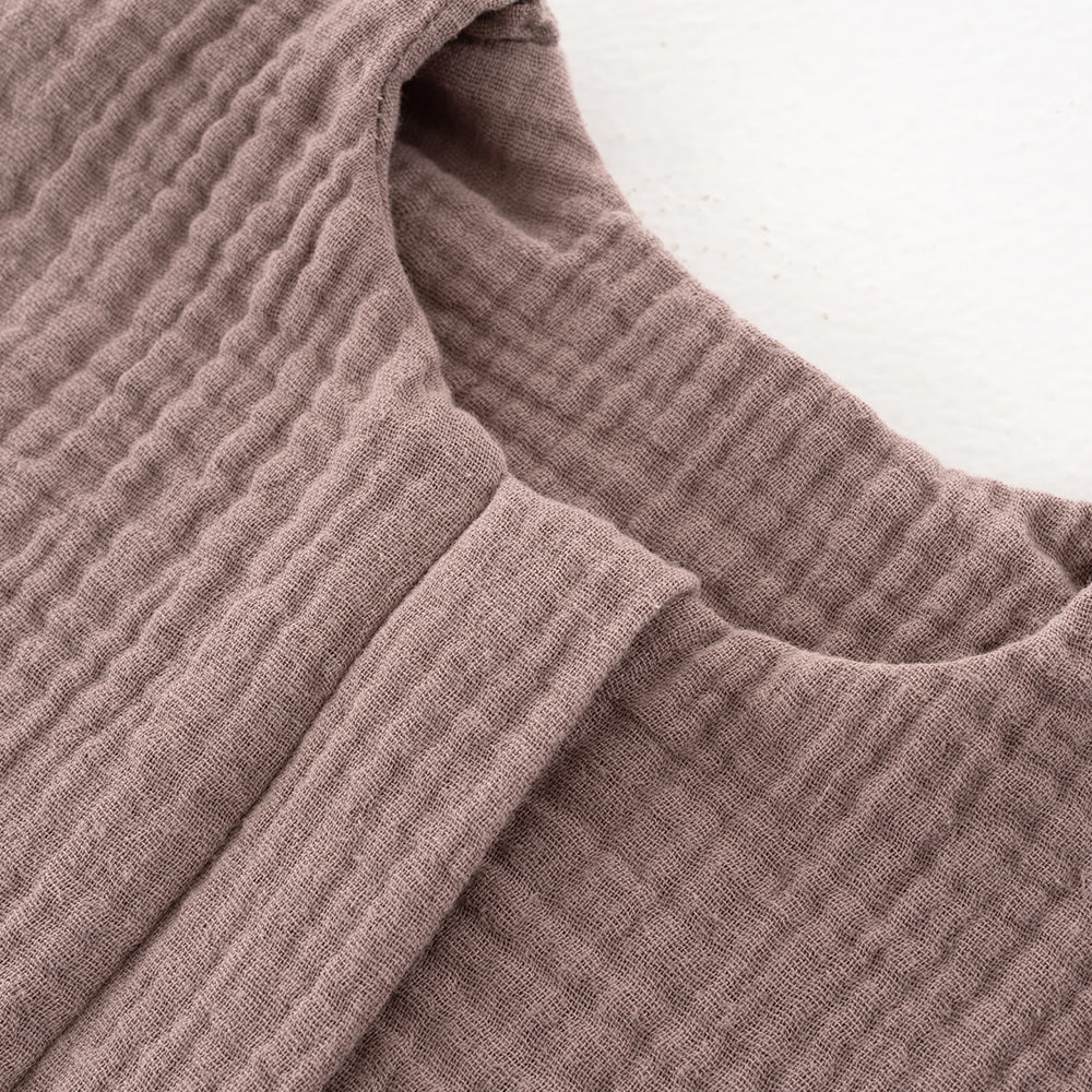 Musselin kastanie Detail Kinnschutz